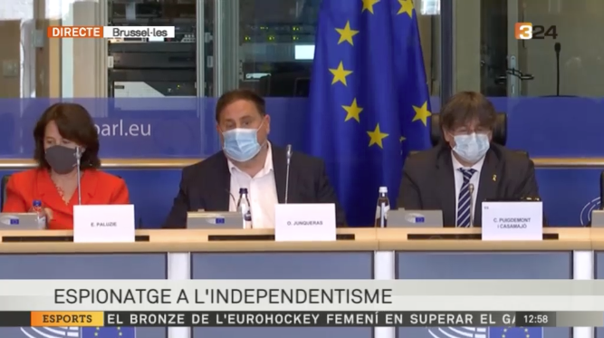 Paluzie, Junqueras y Puigdemont, durante el acto conjunto en Bruselas