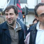 El exconseller Toni Comín con Josep Rull durante la manifestación en favor del catalán en Perpiñán (ACN)