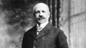 Retrat de Francesc Ferrer i Guàrdia en un fons difuminat