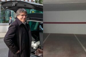 Puigdemont somrient davant d'un vehicle amb un fons urbà